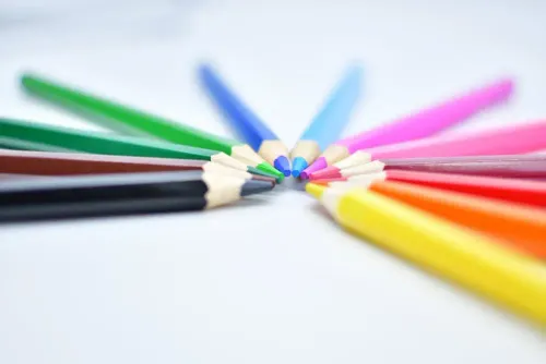 multi_color_coloring_pencils_on_white_surface.webp